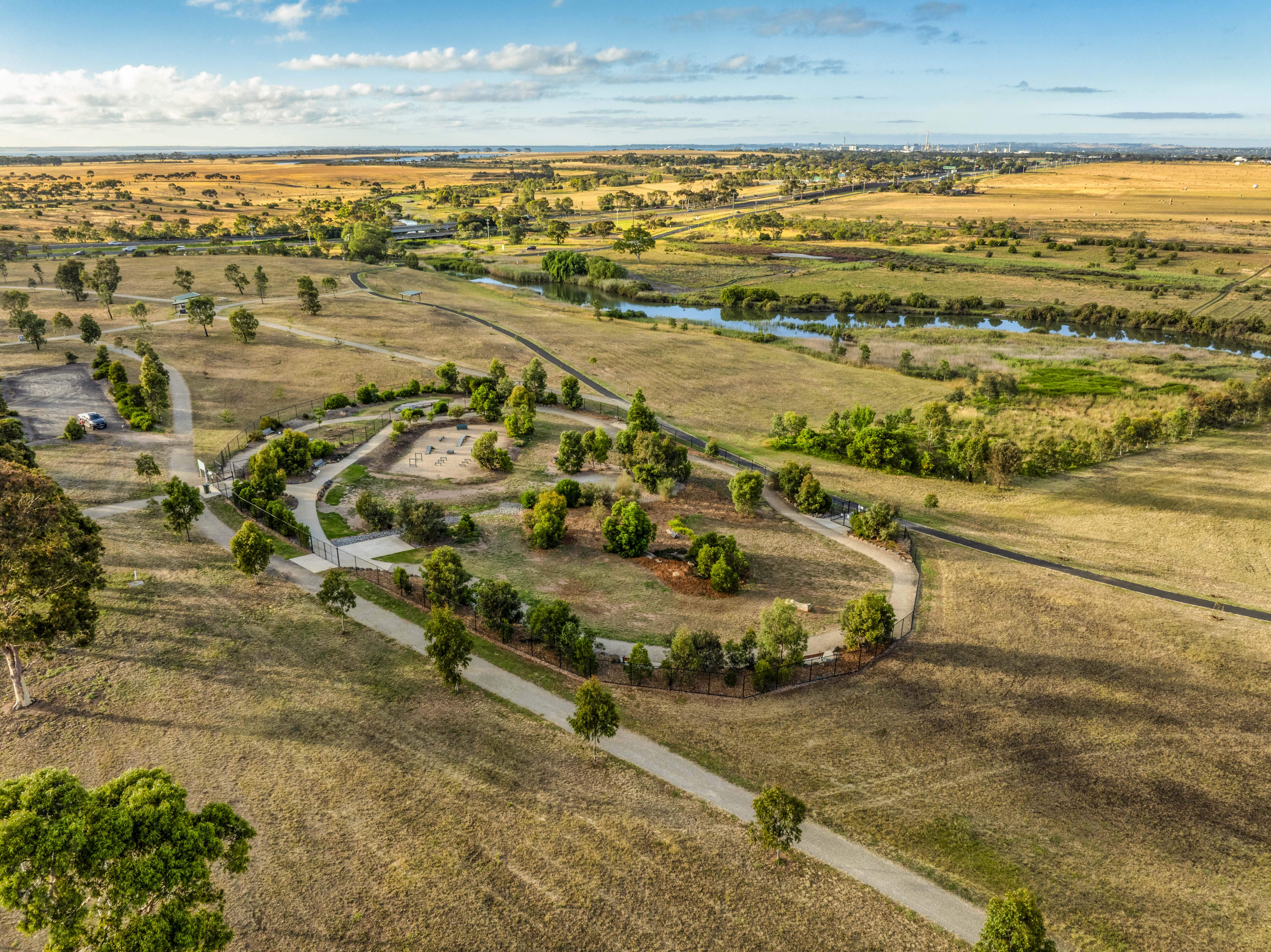 Farmland to the horizon, and a fenced reserve where paddocks were.