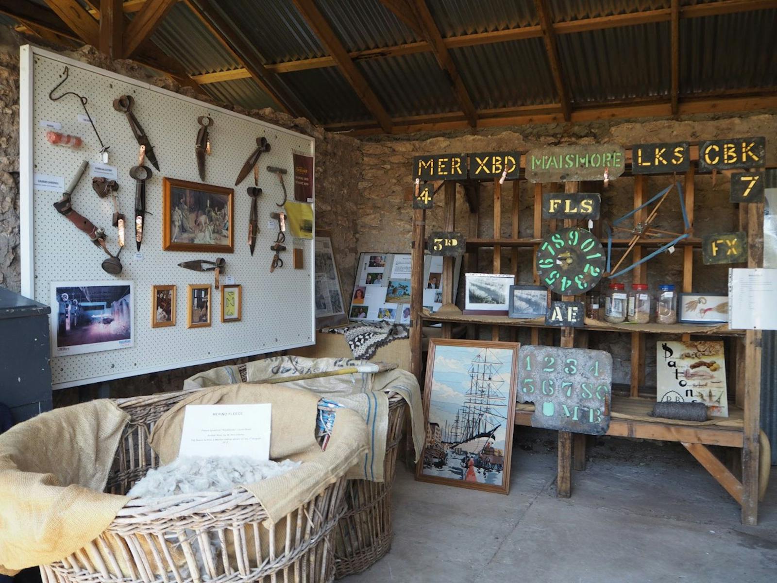 Tools and artefacts on display at a historic woolshed museum