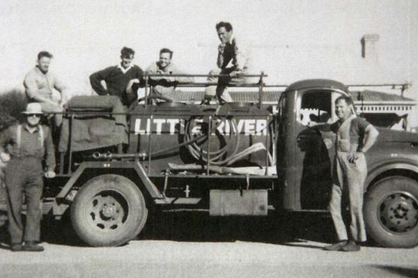 A historic photograph of Little River CFA volunteers with their fire truck