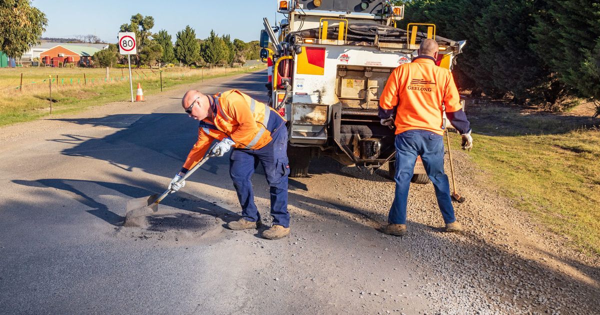 A City of Greater Geelong road crew patching a pothole on a rural road