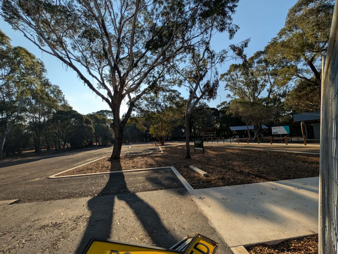 Resurfaced and line-marked car park at Serendip Sanctuary with bollards and mulched beds